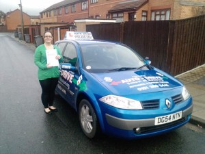 Alison past her test with Auto Drive and showing off her certificate